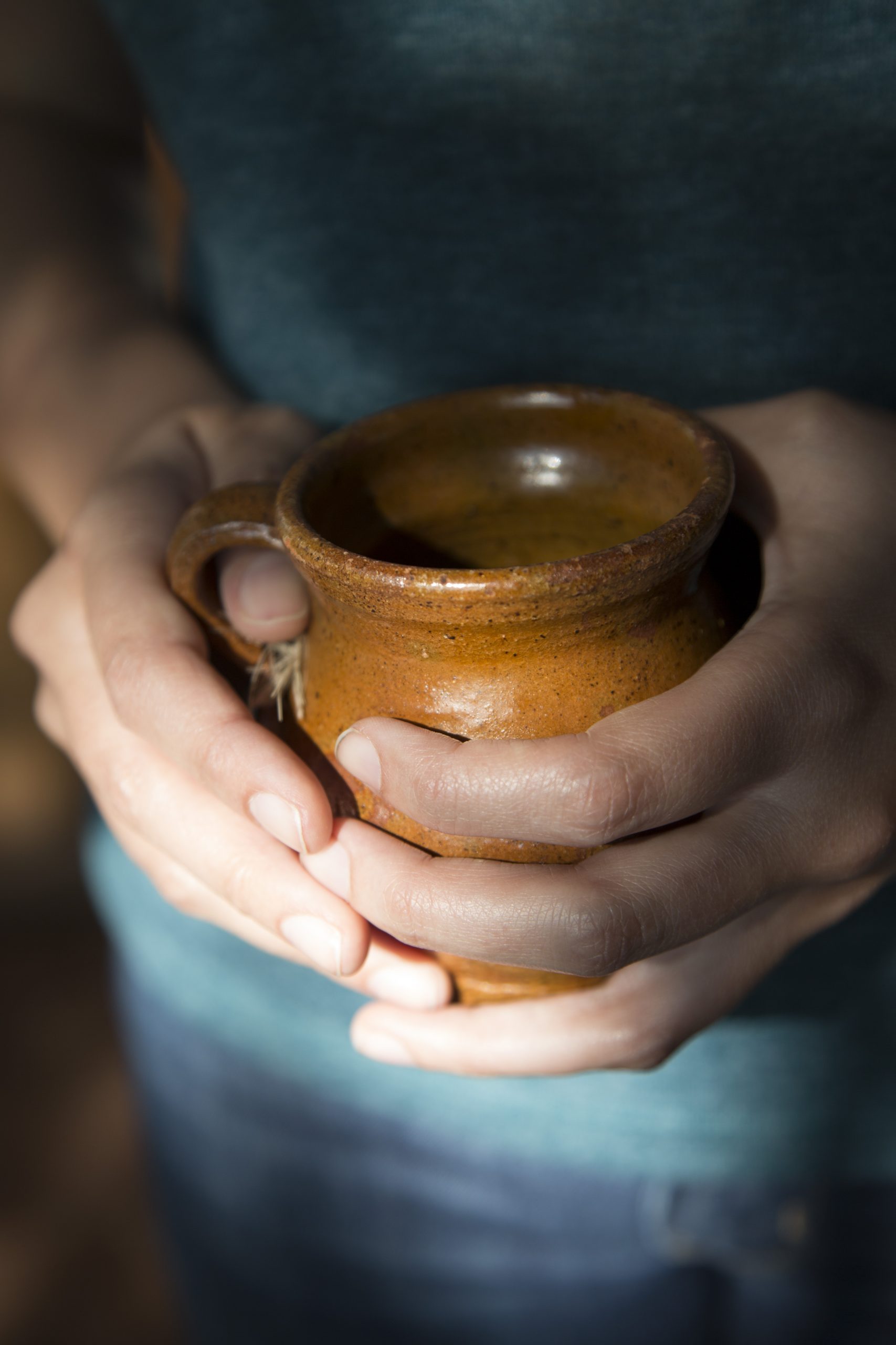 A cup of ceremonial cacao held in two hands