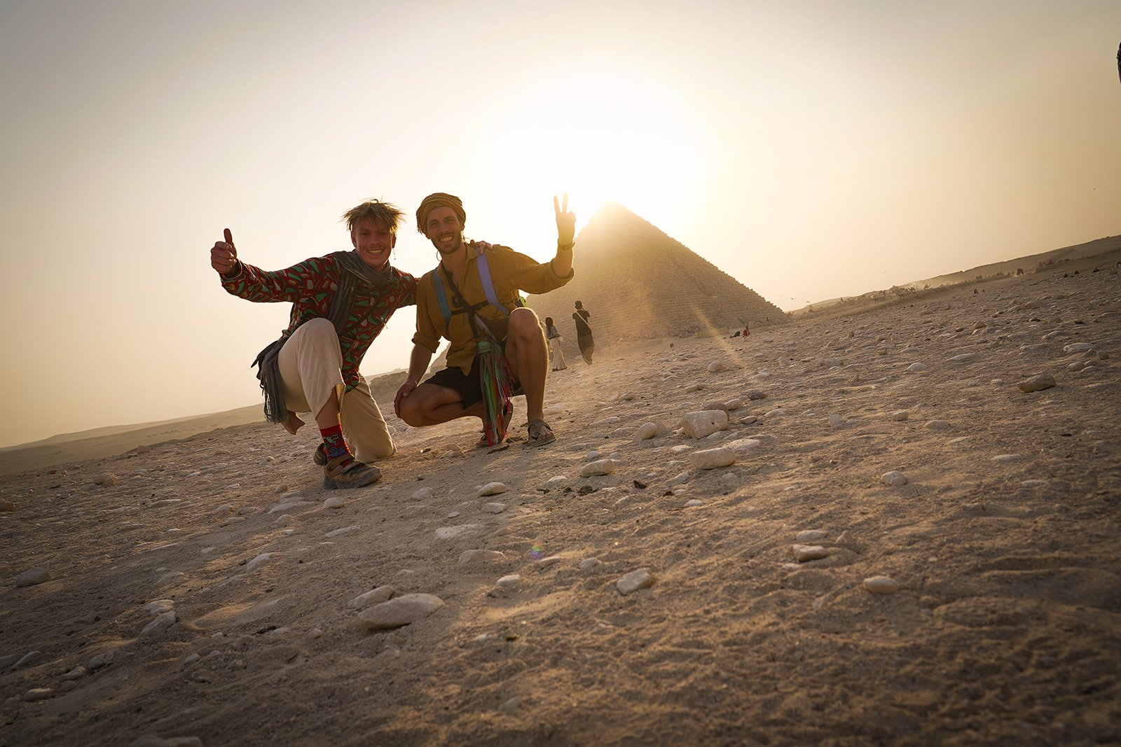 Marc and Bruno in front of the Pyramid of Giza, backlit